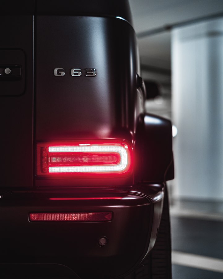 Red rear light and G 63 lettering in an underground car park