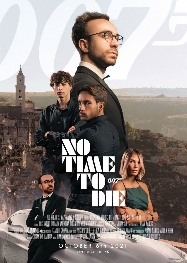 Film-style poster of a man in glasses with the cast in front of a historic town