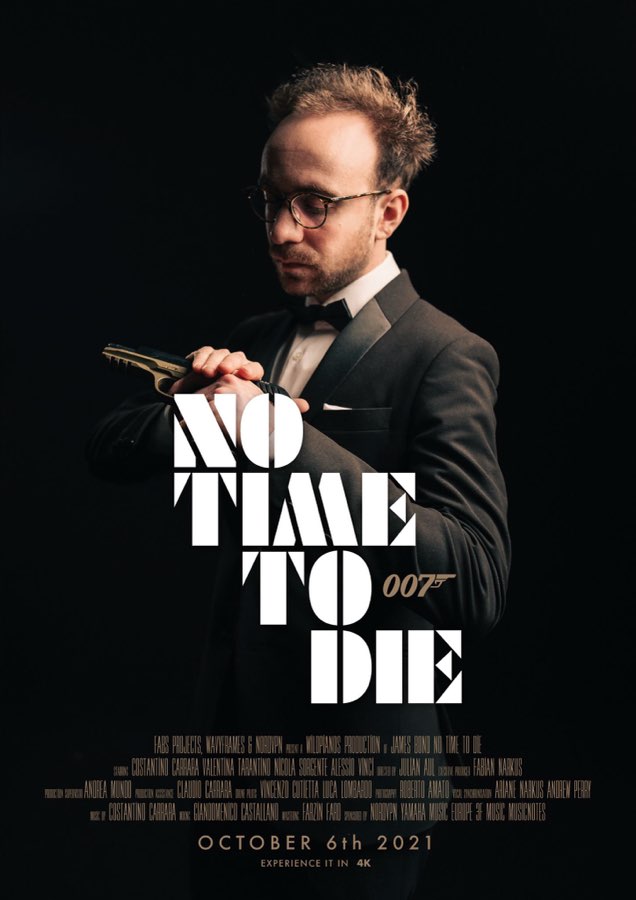 Poster of a man in a tuxedo holding a pistol, with the No Time To Die title
