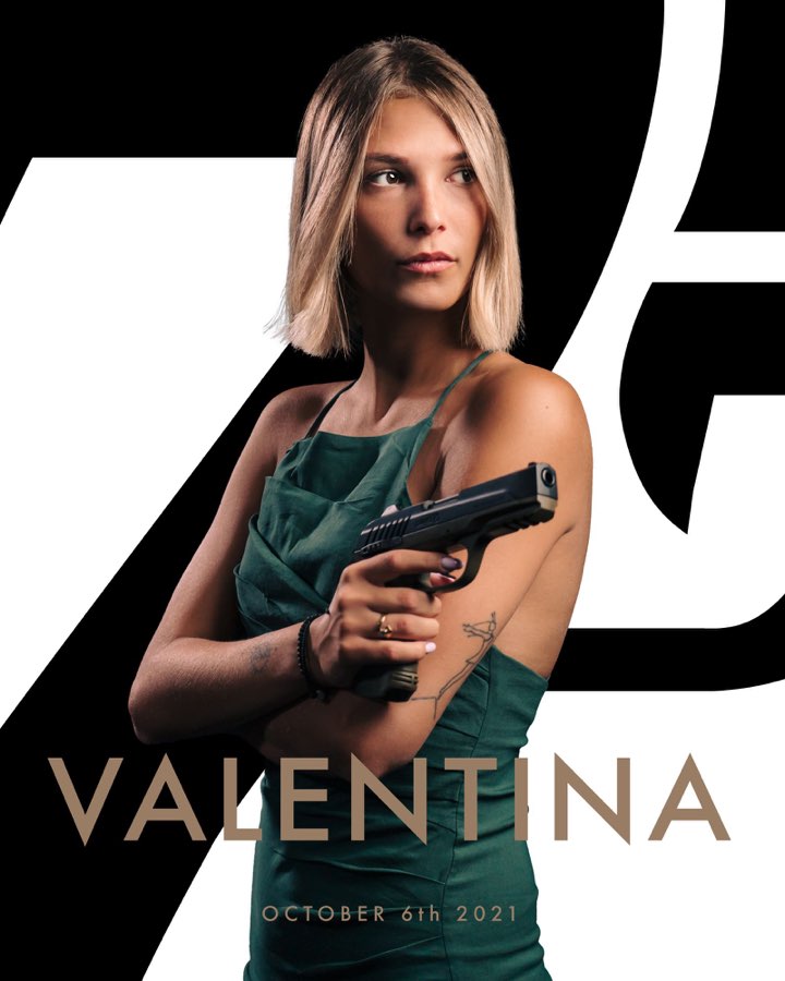 Character poster of a woman in a green dress holding a pistol, titled Valentina